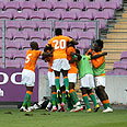 Ivory Coast players celebrate goal 