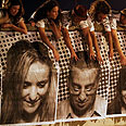Israeli artists place large portraits on side of bridge near Netanya