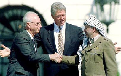Clinton with Rabin and Arafat at the signing of the Oslo Accords (Photo: Reuters)