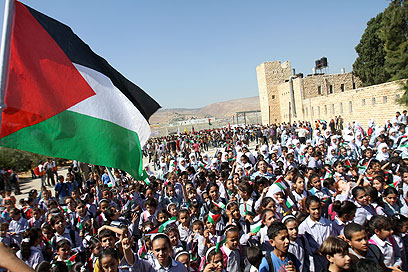 Palestinians take to the streets (Photo: EPA)