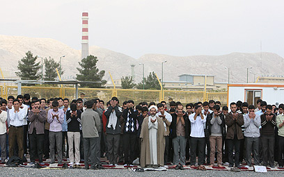 Prayer session outside nuke site (Photo: AP)