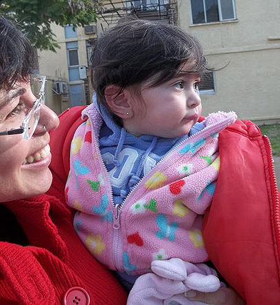 Meital Trebalsi with her one-year-old daughter. 'We want to raise our children in Sderot' (Photo" Anav Silverman)