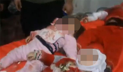 ילדים נטבחו בחומס. צילום מתוך הסרטון  ()