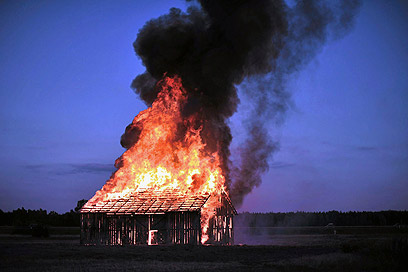 In 2010, a Polish artist set a barn on fire to commemorate the Jedwabne massacre, when Poles killed their Jewish neighbors en masse (Photo: Reuters) 
