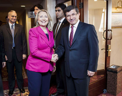 'Broken promises.' Clinton with Turkish FM Davutoglu (Photo: AFP)    