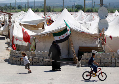 מחנה פליטים במחוז הטאי. בטורקיה יותר מ-35 אלף פליטים סורים (צילום: רויטרס) (צילום: רויטרס)