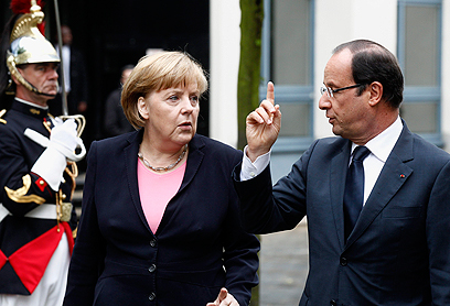נשיא צרפת הולנד וקנצלרית גרמניה מרקל (צילום: רויטרס) (צילום: רויטרס)