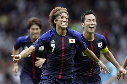 יוקי אטסו חוגג את שער הניצחון של יפן מול ספרד (צילום: AFP) (צילום: AFP)