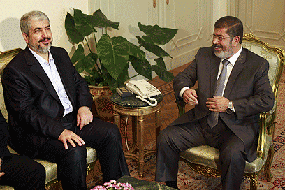 Former Egyptian president Mohamed Morsi, right, meets with Hamas chief Khaled Mashaal in Cairo (Photo: Reuters) (Photo: Reuters)