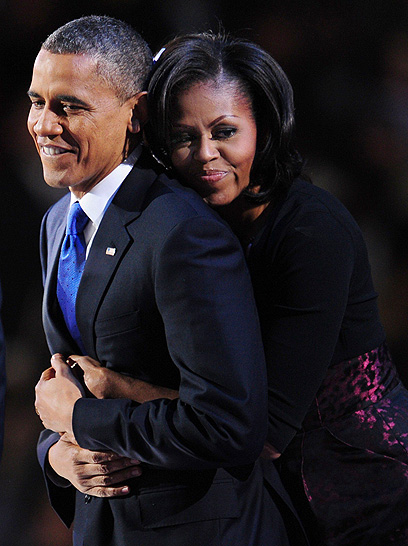 הנשיא קיבל קולות רבים מהיספנים ושחורים. הזוג אובמה (צילום: AFP) (צילום: AFP)