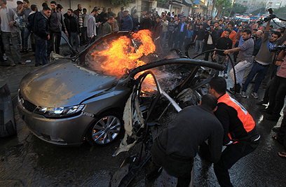 Jabari's car after IDF strike (Photo: AFP)