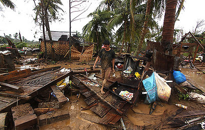 באחת הערים שהוכו בטייפון, 95% מהבתים ניזוקו (צילום: AFP) (צילום: AFP)
