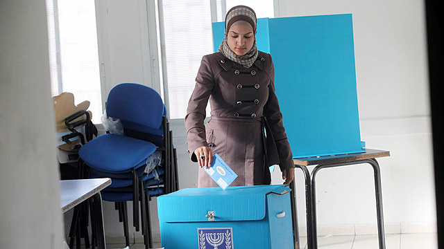 Israeli Arab woman votes in 2013 elections. 'We share the same fate' (Photo: Gil Yohanan)