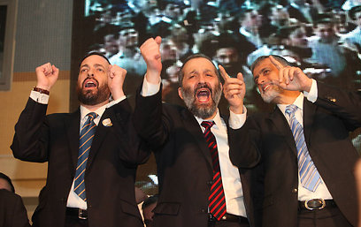 JANUARY 22: (L-R) Ariel Atias, Aryeh Deri and Eli Yishai celebrate Shas' success in the Israeli general elections (Photo: Gil Yohanan) (Photo: Gil Yohanan)