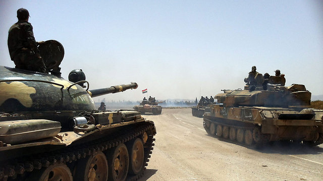 Syrian army tanks heading to Qusayr (Photo: AFP)