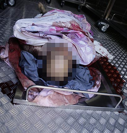 Body of slain pro-Assad pundit (Photo: AFP) (Photo: AFP)