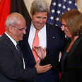 Kerry (center) with Erekat and Livni