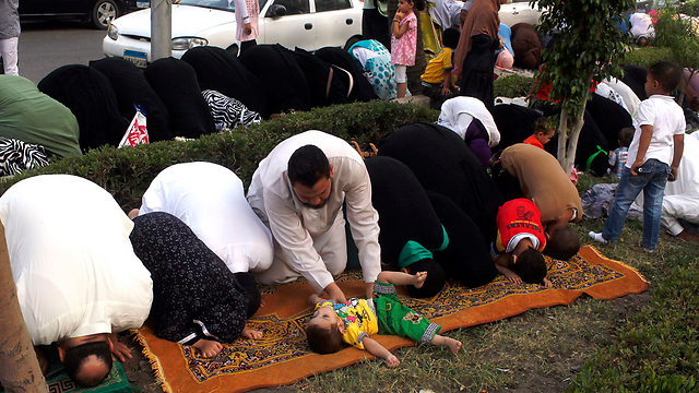 Morsi supporters during Eid al-Fitr prayer (Photo: REuters)
