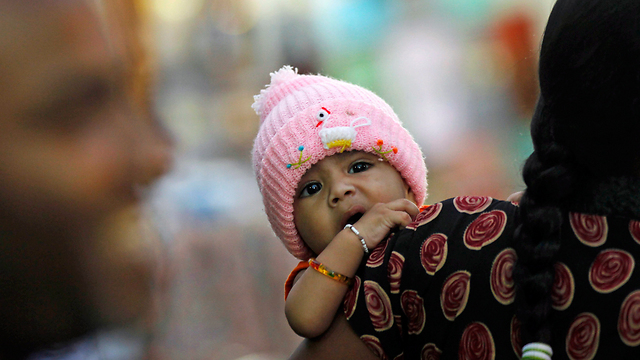 Sri Lanka baby wears pink (Photo: AP)