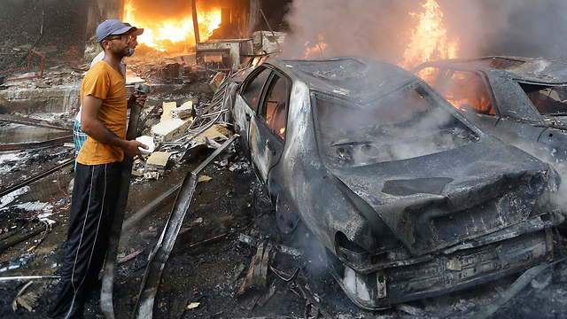 הפיגוע אתמול בדאחייה (צילום: AP) (צילום: AP)