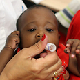 Baby given polio vaccine in nationwide campaign