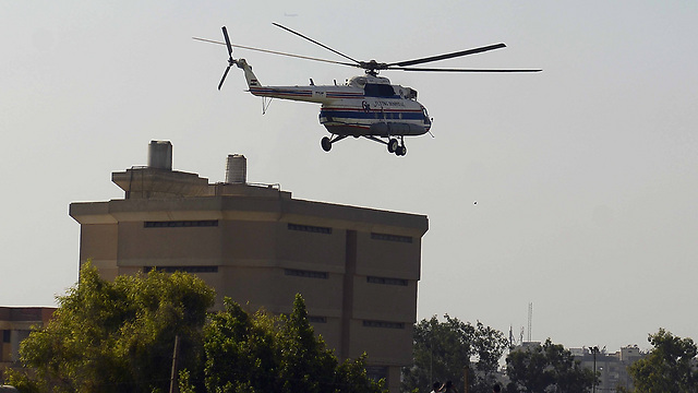 Helicopter arrives at prison (Photo: AFP)