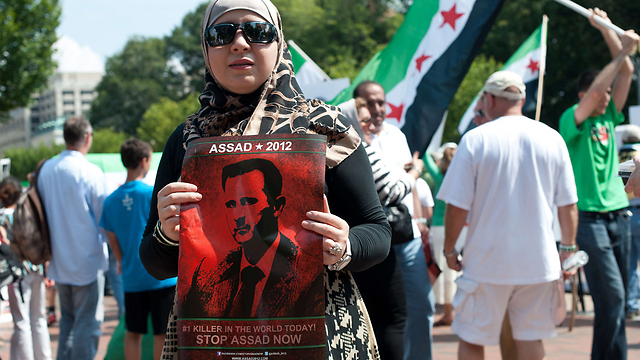 "לעצור את אסד עכשיו". הפגנה מול הבית הלבן (צילום: AFP) (צילום: AFP)
