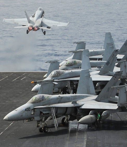 American F-18 fighter jets taking off froman aircraft carrier. (Photo: AFP) (Photo: AFP)