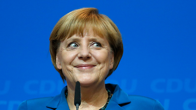 "אעשה הכול כדי שגרמניה תשגשג ב-4 השנים הקרובות". מרקל בנאום הניצחון (צילום: AP) (צילום: AP)