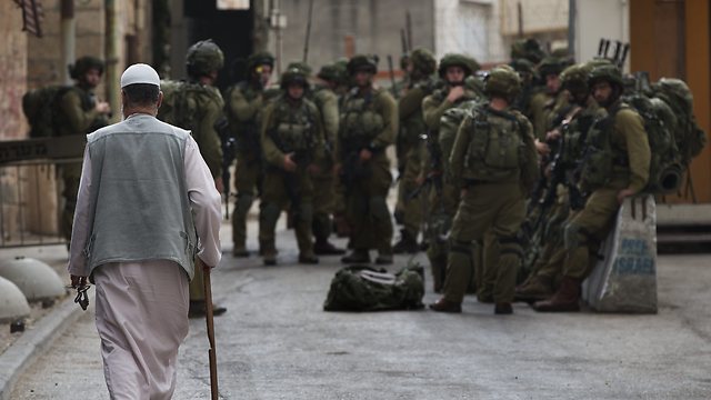 Military patrol in Hebron. Will IDF presence remain strong? (Photo: AP) 