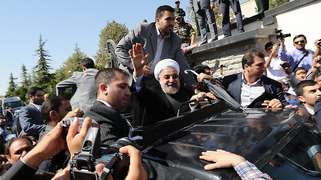 Rohani welcomed back in Tehran (Photo: AFP)