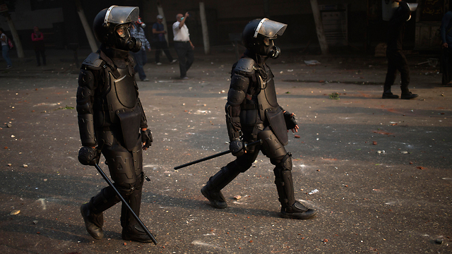 Police officers during clashes (Photo: AP)