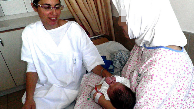 Mother and newborn in Safed hospital (Photo: Hannah Bikel)