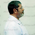 Morsi in administrative prisoner's uniform 