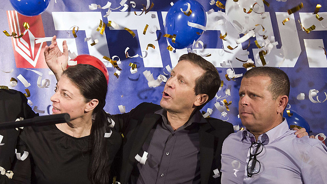 Herzog celebrates victory with MK Michaeli (R), MK Cabel (L) (Photo: AFP)