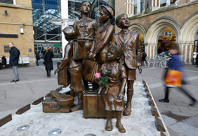 Rose placed on a sculpture memorial outside Liverpool Street Station in London (Photo: AP)