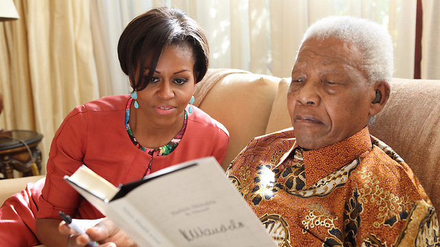 With Michelle Obama (Photo: EPA)