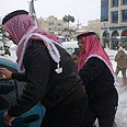  King Abdullah II of Jordan gives helping hand in snow
