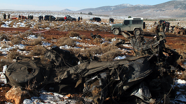 The burned-out car (Photo: AFP)