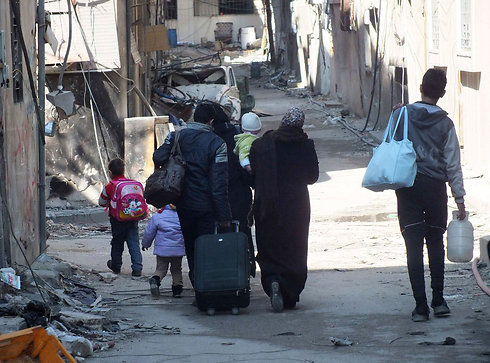 Citizens evacuated from Homs (Photo: Reuters) (Photo: Reuters)