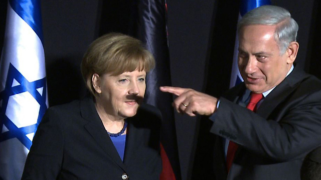 Netanyahu and Merkel in a now-famous snapshot (Photo: AFP) (Photo: AFP)