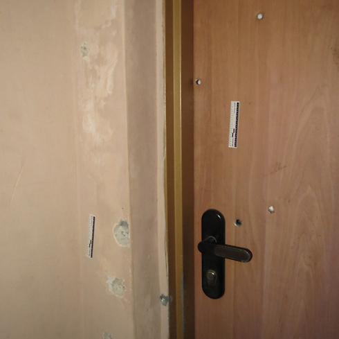 Bullet holes in imam's house (Photo: Hassan Shaalan)