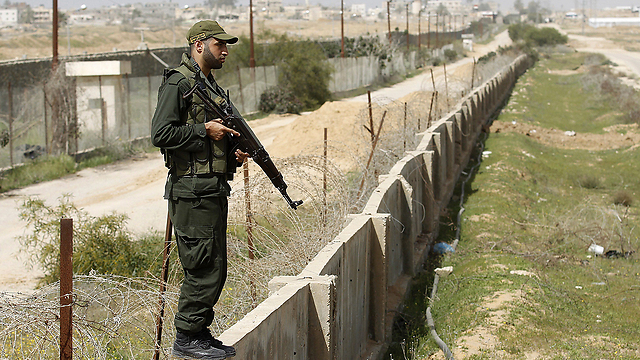 Hamas man watches over border with Egypt (Photo: AFP)