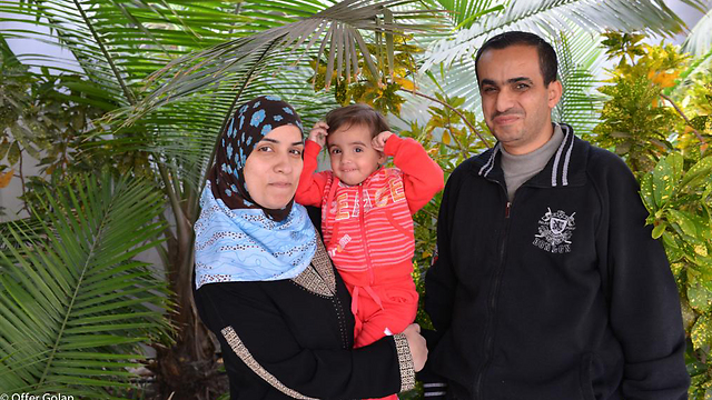 Maeesa, Khaled, and baby Lian (Photo: Ofer Golan)