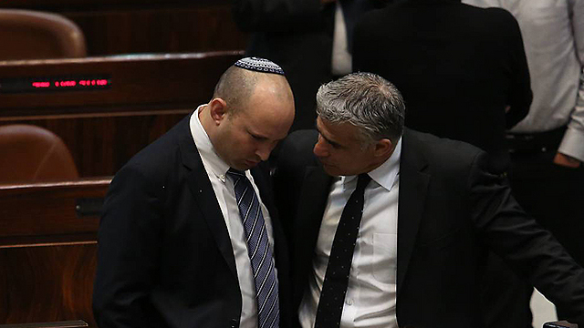 Finance Minister Yair Lapid and Economy Minister Naftali Bennett (Photo: Gil Yochanan)