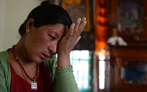 דלי, איבדה את בעלה במפולת (צילום: AFP) (צילום: AFP)