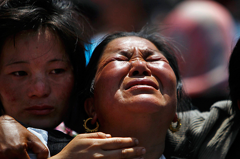 דורשים פיצויים. משפחות הקורבנות (צילום: AP) (צילום: AP)