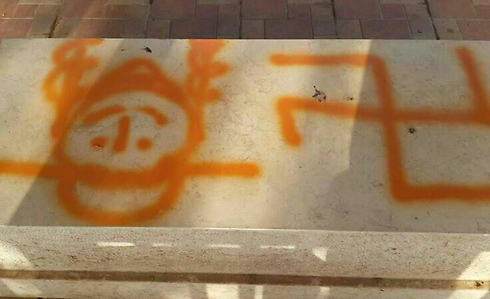 Swastika, haredi image spray-painted in a cemetery near Hadera (Photo: Menashe Regional Council)