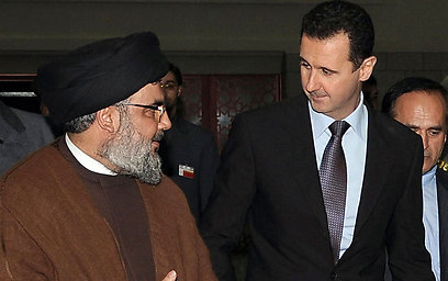 Assad with Hezbollah chief Nasrallah (Photo: AP)