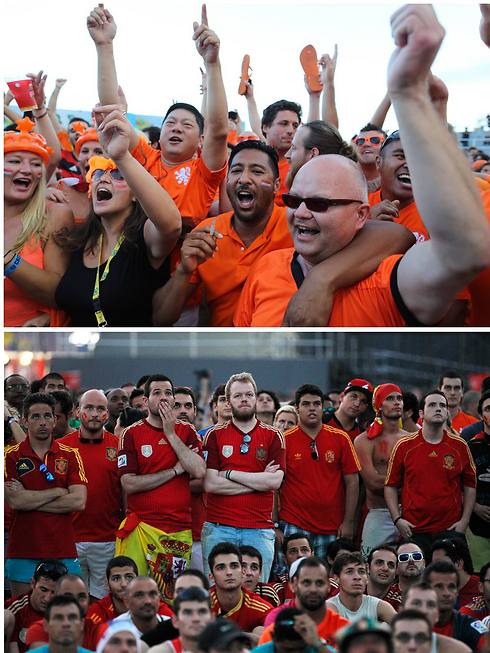 אלה שחוגגים ואלה שהמומים. אוהדי נבחרת הולנד ואלה של ספרד (צילום: AP) (צילום: AP)